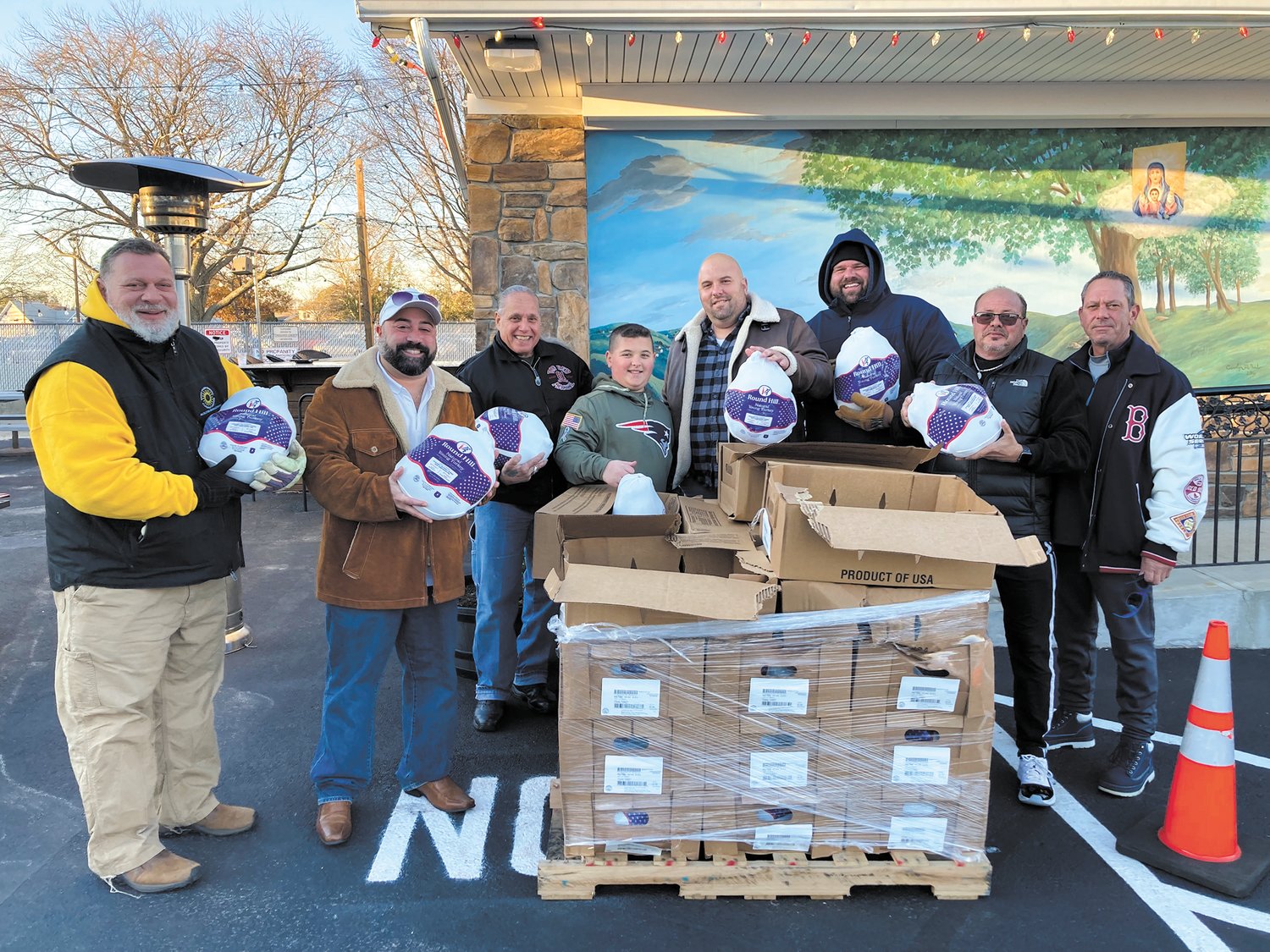 THEY’RE ALL FROZEN: Volunteers handed out frozen turkeys outside St. May’s Feast Society Monday afternoon. (From left) Brian Aschettino, St. Mary’s Feast Society Vice President Ryan Nardolillo, Joe Traficante, Matthew Volpi Jr., St. Mary’s Feast Society President Matthew Volpi Sr., Ward 5 Councilman Chris Paplauskas, Bobby Battista and John Stravato. (Herald photo)